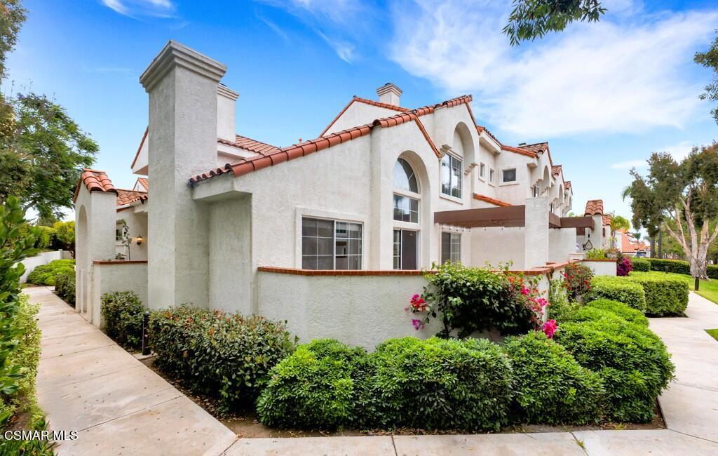 Welcome to your dream home in beautiful Camarillo! This delightful 3-bedroom, 3-bathroom, 1,860 sq ft Palm Colony, corner unit is a perfect blend of comfort and style. The freshly painted light and bright open floorplan welcomes you with vaulted ceilings, recessed lighting and newer luxury vinyl flooring throughout. Enjoy quiet evenings next to the cozy fireplace in the living room or entertain family and friends on the private patio. The generous kitchen features stainless steel appliances, modern white cabinets, island and overlooks the dining area. A main level bedroom, full guest bathroom as well as an attached, direct access 2-car garage complete the first floor. The allure continues as you ascend to the second story where the primary retreat awaits boasting a fireplace, ensuite bath and spacious walk-in closet, dedicated laundry room and a well-appointed secondary bedroom, complete with its own ensuite bathroom and lovely view. Community amenities include a refreshing pool, spa, clubhouse and more. Centrally located near restaurants, shopping and schools. Your new home awaits!