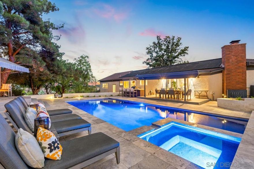 WILL NOT LAST! Welcome to your private 1.14-acre hillside sanctuary, perched atop Mount Merritt with breathtaking panoramic mountain views and a brand-new pool, spa, and outdoor kitchen! This residence is a modern sanctuary, a designer masterpiece and entertainer’s dream, seamlessly balancing indoor-outdoor living with timeless mid-century flair throughout. Step inside to soaring vaulted wood-beamed ceilings, an open floor plan, and abundant natural light streaming through every window.  The thoughtful layout lives like a single story, with most rooms on the main level and the private primary suite tucked away on its own level for ultimate privacy. The elegant dining area and cozy sitting lounge open to expansive view decks, the perfect place to watch the sunset. The kitchen flows effortlessly into the great room, where oversized picture windows frame the stunning mountain backdrop. A built-in bar and inviting fireplace set the tone for both lively entertaining and relaxed evenings at home. Discover 3 spacious bedrooms, a beautifully remodeled bathroom, and a generous laundry room with access to the 3-car garage. Step outside to your resort-style backyard oasis! Dive into the sparkling new pool and spa, fire up the outdoor kitchen with built-in BBQ, or gather around the firepit lounge for starlit evenings surrounded by nature and serenity. Every detail has been meticulously curated with no expense spared, from Restoration Hardware and Pottery Barn fixtures to custom mirrors, designer!