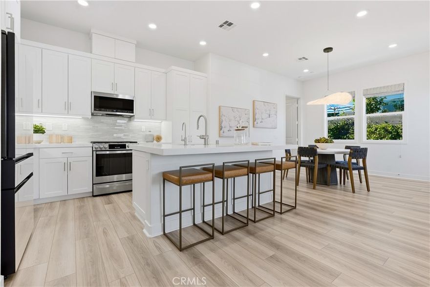 Experience effortless Southern California living at 790 Sunrise, a beautifully refined single-level home tucked within the exclusive 55+ Gavilan community of Rancho Mission Viejo. Designed with comfort and simplicity in mind, this residence welcomes you with an airy open floor plan filled with natural light and framed by expansive windows that capture serene neighborhood views. The kitchen serves as the home’s central gathering place, featuring polished quartz countertops, stainless-steel appliances, and a seamless flow into the great room, ideal for casual evenings in or entertaining with ease. A dedicated formal dining space elevates dinner parties and celebrations with its warm, inviting ambiance. The primary suite offers a peaceful retreat with a walk-in shower, dual vanities, and a custom California Closet system that keeps everything beautifully organized. Guests will enjoy a private second bedroom and full bath, while the sunlit office at the front of the home provides the perfect setting for reading, work, or creative pursuits. Thoughtful upgrades enhance daily living, including owned solar, a whole-house soft-water system, pull-out kitchen cabinetry, frameless shower enclosures, an upgraded dishwasher, and over $30,000 in post-purchase improvements that elevate style and convenience throughout. Beyond the home, you’ll enjoy a vibrant, resort-style lifestyle with exclusive access to private Gavilan 55+ amenities including The Perch, The Hacienda, The Outlook, The BBQ Barn, and The Getaway. Stay active and connected with a state-of-the-art fitness center, saltwater pool, spa, cabanas, bocce ball courts, yoga studio, fire pits, and social lounges. And when the grandkids visit? You’ll have full access to Rancho Mission Viejo’s award-winning all-ages amenities, arcade, community farms, fitness centers, indoor basketball gym, putting green, Sports park, tennis and pickleball courts, parks, and events that make this community unlike any other.