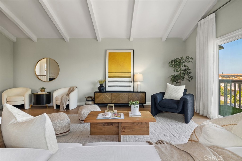 Perched at the highest point of Golden Hills, this spacious family home offers sweeping mountain and city views with unbeatable coastal convenience. Just one block from Hermosa Beach and a short walk to Hermosa Pier, it sits in the heart of the South Bay—offering walk- and bike-friendly access to surf, dining, and entertainment, plus convenient freeway access for easy commutes, 15 minutes to LAX.
The upper-level features vaulted ceilings and abundant natural light, with European oak flooring throughout the home providing an airy, open feel. Relax or entertain in your bright oversized living room, leading to your panoramic view balcony. Even at night, this view never disappoints- pour a glass of wine and watch the planes touch down on the horizon, framed by twinkling city lights. The updated kitchen includes a farmhouse kitchen sink, stainless steel appliances, and quartz countertops. The upper-level primary suite offers vaulted ceilings, a private balcony and dual-vanity bath, while the two generously sized lower-level bedrooms are ideal for kids’ rooms, play space, or flexible family living that grows with you.
Step outside to a private, bamboo-lined backyard patio with turf—a tranquil, low-maintenance retreat perfect for morning coffee, summer barbecues, or evening relaxation. The high ceiling, epoxy-coated garage floor adds polished durability, and extra storage, making it perfect for a gym, playroom, or extra living space. Central air has been added as well.
Families will appreciate being close proximity to Jefferson Elementary, a 2023 California Distinguished School consistently ranked among the top 5% of elementary schools in the state. Beyond the home itself, the neighborhood hosts an annual Halloween block party, creating a warm, welcoming community where neighbors connect and lasting memories are made.