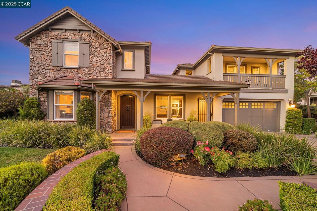 This breathtaking two-story estate offers 6 bedrooms, 6.5 baths, and resort-style luxury in one of Danville’s most coveted neighborhoods. Enter to soaring ceilings, abundant natural light, rich cherry hardwood floors, crown molding, built-in speakers, refined custom finishes and a full security system. To the left, an elegant formal living room with a white mantel and gas fireplace; to the right, a sophisticated den with custom cherry built-ins, ideal for a home office. The chef’s kitchen features a grand island, sumptuous cherry cabinetry, stainless steel appliances with a six-burner stove, and a butler’s pantry with wine fridge opening to an expansive dining room. The lavish primary suite showcases stunning Mt. Diablo views, a spa-like bath with soaking tub, dual vanities, walk-in shower, and a massive custom walk-in closet. Step outside to a private courtyard with fireplace and a fully equipped in-law suite with kitchen, bath, balcony, and separate entry. The entertainer’s backyard dazzles with panoramic Mt. Diablo views, a heated saltwater pool, spa, bocce court, garden beds, and a peaceful fountain. The outdoor kitchen is a chef’s dream with built-in grill, fireplace, warming drawers, fridge, dishwasher, and sink—perfect for luxurious outdoor living.