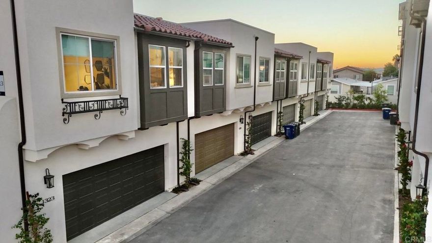 Introducing a revolutionary lifestyle opportunity at City Ventures' newest neighborhood in El Cajon, featuring modern, eco-friendly townhomes designed for the future. Each home includes owned solar power and is built all-electric, showcasing sleek stainless steel kitchen appliances, sophisticated flat panel cabinets, and smart built-in technology. Specifically, the exceptional Lot 5 floor plan offers an expansive layout with 3 bedrooms plus a versatile den and a bright, open kitchen. This unit boasts designer-selected upgrades, including a premium kitchen countertop and tile package, along with beautiful Revwood flooring, ensuring a high-end, stylish finish that is both durable and easy to maintain. Live sustainably and in luxury in this stunning new community