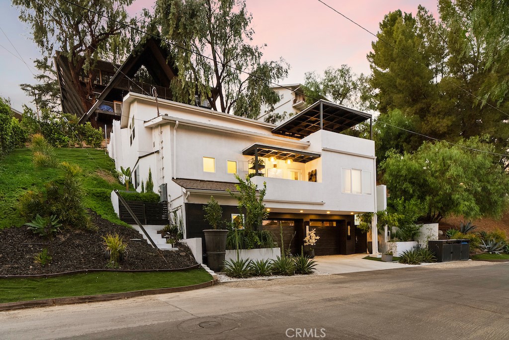 Welcome to your fully reimagined, move-in-ready Smart Home in the heart of Woodland Hills, South of the Boulevard. This meticulously updated residence combines style, functionality, and modern luxury, offering seamless indoor-outdoor living in one of the area’s most desirable neighborhoods.
Inside, you’ll find a spacious lounge with a dedicated office nook, perfect for today’s work-from-home lifestyle. The expanded Primary Suite offers a spa-inspired en-suite bath, a cozy sitting area, and direct access to a private upper deck retreat. Designed with entertaining in mind, the deck is ideal for gatherings, outdoor movie nights, or quiet evenings under the stars. Additional design upgrades include striking Ebony wood flooring throughout, plush double-padded carpet on the stairs for added comfort and sound reduction, and covered exterior decks with elegant wood pergolas.
This home is fully enhanced with Smart Home technology, including Cat 6 WiFi cabling for seamless connectivity, a voice-activated smart system, smart lighting and blinds, and smart locks for added security. The garage is equipped with an EV charging station and finished with carpeting, offering flexibility as a home gym or bonus space.
Outside, new professional landscaping enhances curb appeal with drought-resistant plants and lush greenery, creating a low-maintenance yet inviting environment.
Conveniently located near local cafés, boutiques, The Village, the LA Rams Training Center, and with easy freeway access, this home offers both luxury and lifestyle.
Don’t miss the opportunity to make this beautifully reimagined Woodland Hills Smart Home your own.