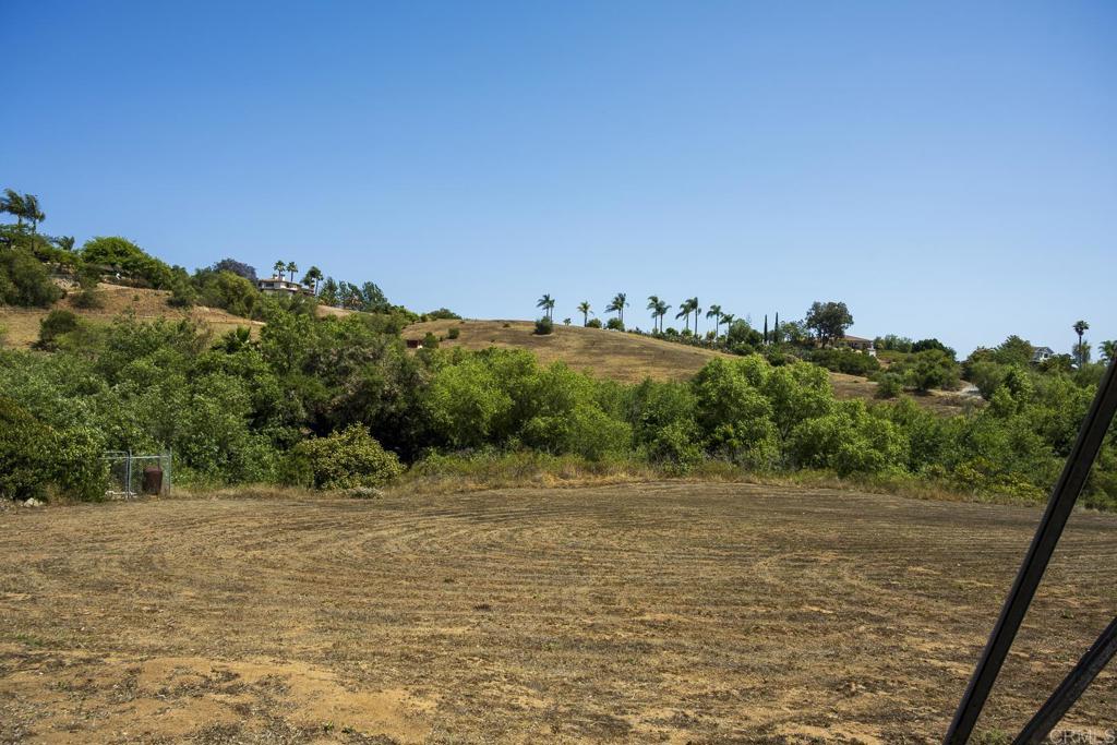 Discover the perfect canvas for your dream home on this stunning 6.64-acre parcel Homesite with Rolling Hills and Sweeping Views nestled in desirable Bonsall! This spacious lot is tucked away in a peaceful neighborhood with rural charm! Boasting of breathtaking panoramic views, seasonal stream and a rare blend of natural beauty and privacy. Zoned for agricultural and equestrian use, this property is ideal for creating a custom estate, hobby farm, or horse property. The land features rolling terrain, possibility for multiple potential building sites and according to Rainbow Water District, a 1-inch water meter is already installed—a valuable and time-saving utility improvement. Whether you're envisioning a serene retreat, a family compound, or your private ranch, this exceptional homesite provides endless opportunity in a highly sought North County location just minutes from shops, exceptional Bonsall schools, and commuter routes. Easy access to Old Hwy 395, Hwy 76, I-15, and coastal amenities. Embrace the Bonsall lifestyle and build your vision on this one-of-a-kind property. Opportunities like this are rare—don’t miss out! Buyers are advised to do their own Due Diligence. Agents have not verified information or buildability pertaining to the property.