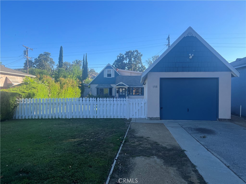 Charming Storybook Cottage – 1518 Lake Street, Glendale
Welcome to this delightful home in the desirable Riverside Rancho neighborhood. Featuring 3 bedrooms (or 2 plus an office/den), an updated bathroom, sunroom with laundry hookups, and a finished one-car detached garage. The living and dining areas are warm and inviting, and the primary bedroom boasts a wood-planked ceiling. Enjoy a cozy kitchen, central air and heating, and a sprinkler system. Outside, relax on the charming front porch, in the lush yard with a white picket fence, or on the multiple patio areas in the front and side yards. Located just one block from Franklin Elementary and walking distance to Disney Creative Campus, parks, trails, and more. Easy freeway access and shopping nearby. Explore all that Rancho living has to offer!