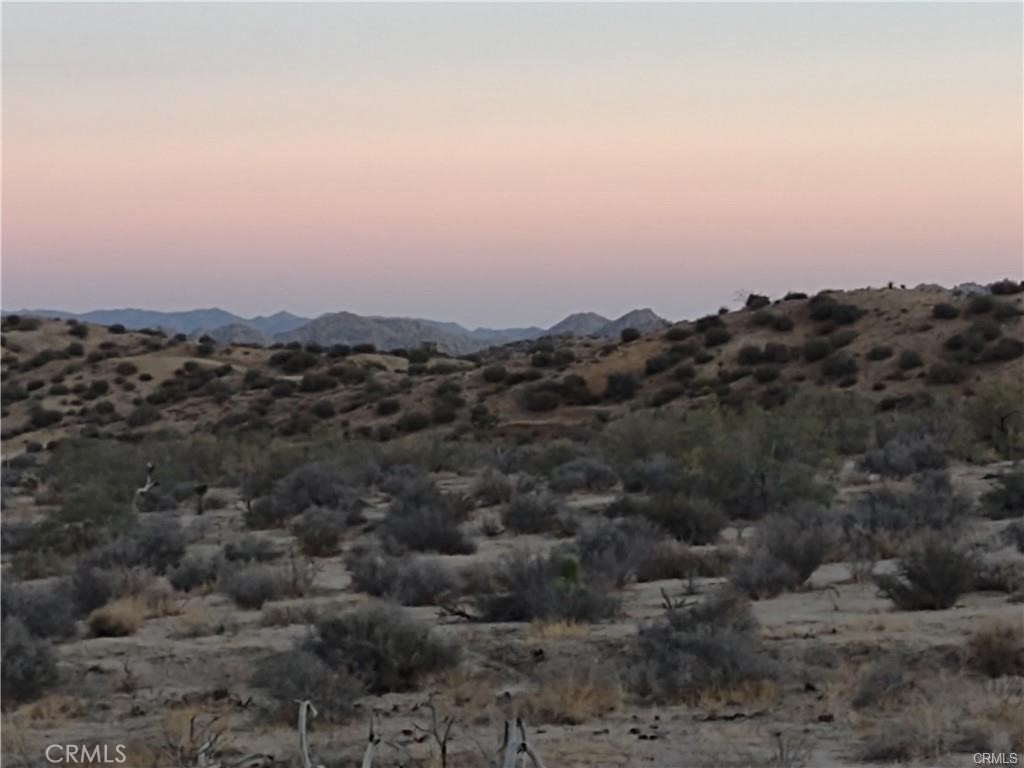 Million-dollar views!! Electricity is available. SEE THE VIDEO ABOVE! PRIVATE! ONE OF A KIND!! SELLER MAY CARRY PAPER! CALL FOR DETAILS! Create your compound for friends & family. The north boundary of the preserve is only five lots to the South. This lot features nearly 10 acres of pristine, virgin desert. You may subdivide into two lots to build your Airbnb retreat or bring your existing vision to life!. The buyer is responsible for verifying all utilities, land use, Building, and zoning processes with the county. This Property has everything you need to make it your Perfect Desert Getaway! Perfect to build and develop. If you're looking for something AMAZING, Look No More!
The area is very private (with multiple deer trails), but still within a 15-minute drive of shopping & standard amenities. For someone with vision, this land can be the perfect location for a truly epic high-desert home or private getaway. Spectacular 360-degree views of incredible high desert scenery, plus living or camping! 5 minutes away from Pioneertown and Pappy & Harriet's. With an abundance of birds and wildlife, this habitat is perfect for being in the heart of this natural desert setting. Watch the living desert come alive before you. An electric pole on the property!! The area is very private (with multiple deer trails), but still within a 15-minute drive of shopping & standard amenities. For someone with a vision, this land can be the perfect location for a truly epic high-desert home or private getaway. Spectacular 360-degree views of incredible high desert scenery, plus living or camping!. With an abundance of birds and wildlife, this habitat is perfect for being in the heart of this natural desert setting. Mountain and desert views surround you in a pristine landscape of native Yucca, Joshua trees, mallow, and desert chaparral. Located in an area known for the purest of desert air, protected by the surrounding Sawtooth Mountains, San Bernardino Mountains, and Black Lava Butte.