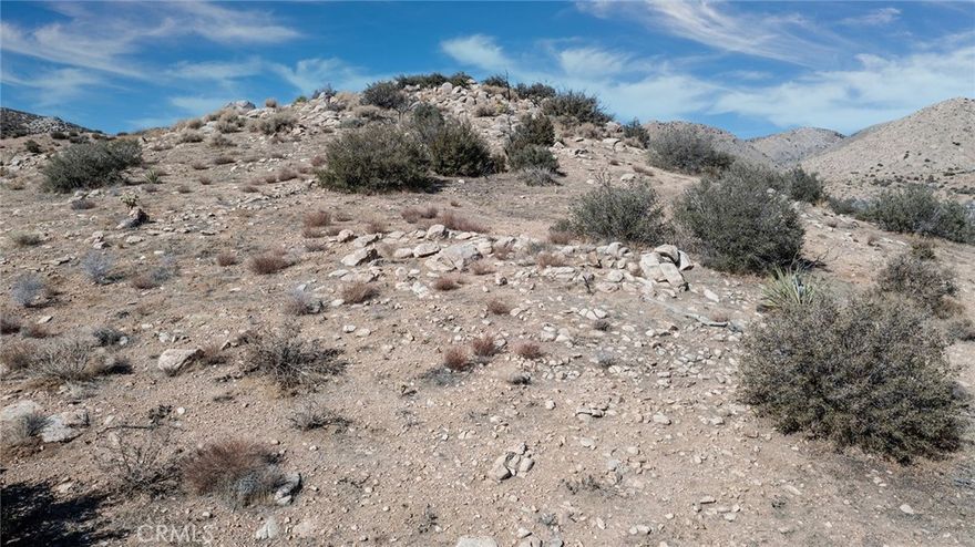 Million-dollar views!! Electricity is available. SEE THE VIDEO ABOVE! PRIVATE! ONE OF A KIND!! SELLER MAY CARRY PAPER! CALL FOR DETAILS! Create your compound for friends & family. The north boundary of the preserve is only five lots to the South. This lot features nearly 10 acres of pristine, virgin desert. You may subdivide into two lots to build your Airbnb retreat or bring your existing vision to life!. The buyer is responsible for verifying all utilities, land use, Building, and zoning processes with the county. This Property has everything you need to make it your Perfect Desert Getaway! Perfect to build and develop. If you're looking for something AMAZING, Look No More!
The area is very private (with multiple deer trails), but still within a 15-minute drive of shopping & standard amenities. For someone with vision, this land can be the perfect location for a truly epic high-desert home or private getaway. Spectacular 360-degree views of incredible high desert scenery, plus living or camping! 5 minutes away from Pioneertown and Pappy & Harriet's. With an abundance of birds and wildlife, this habitat is perfect for being in the heart of this natural desert setting. Watch the living desert come alive before you. An electric pole on the property!! The area is very private (with multiple deer trails), but still within a 15-minute drive of shopping & standard amenities. For someone with a vision, this land can be the perfect location for a truly epic high-desert home or private getaway. Spectacular 360-degree views of incredible high desert scenery, plus living or camping!. With an abundance of birds and wildlife, this habitat is perfect for being in the heart of this natural desert setting. Mountain and desert views surround you in a pristine landscape of native Yucca, Joshua trees, mallow, and desert chaparral. Located in an area known for the purest of desert air, protected by the surrounding Sawtooth Mountains, San Bernardino Mountains, and Black Lava Butte.