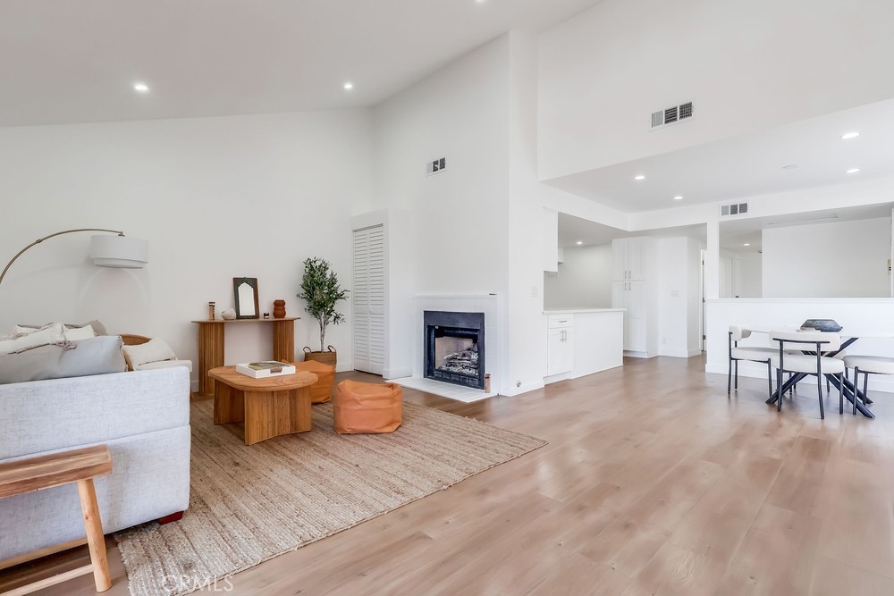 Immaculate, newly renovated condo - largest model in the community - with soaring 12+ ft vaulted ceilings and abundant natural light. The spacious great room features a fireplace, dining area, and new recessed lighting along with brand-new flooring. A sparkling kitchen with new appliances and refreshed baths make everyday living effortless. Retreat to the massive primary suite with vaulted ceilings, floor-to-ceiling closets, and a stylish en-suite bath. Two additional bedrooms and a dazzling hallway bath complete the 1,332 sq ft layout. The oversized 2-car garage includes a new door/opener and a large private storage room - rare in condo living. With new A/C, thoughtful upgrades throughout, and true turn-key condition, this home delivers space, light, and convenience in one exceptional package. Schedule your showing today!