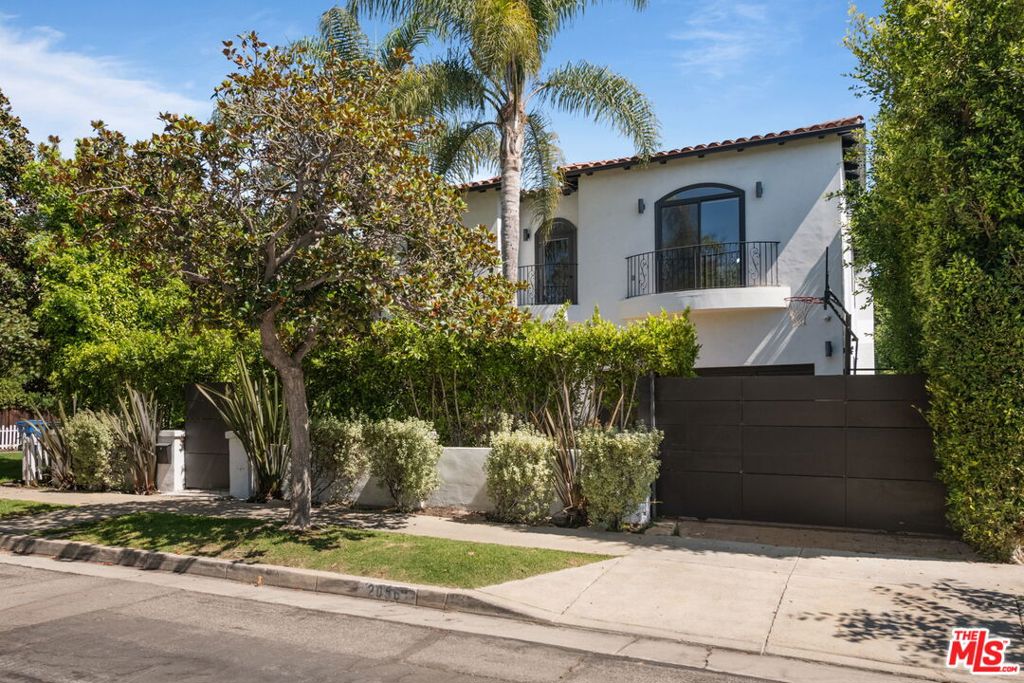Stunning newly remodeled Spanish 5 bed/4.5 bath 2-story in desired mid-block, prime Century City Adjacent location. Privately hedged and gated front yard leads to beautiful open floor plan with dramatic high ceilings, large skylights providing an ambundance of natural light. Living room with marble front fireplace opens to spacious formal dining room with soffit ceilings and arched entrance. Inviting family room with fireplace, built-ins and bi-fold doors leading to entertainer's back deck, pool/spa, lower deck with veranda and firepit area. Newly finished chef's kitchen with center island, quartz countertop and newer high-end appliances including Wolf range and double ovens, Sub Zero refrigerator and contemporary quartz countertops. 1 bedroom downstairs with ensuite bath and 4 additional bedrooms upstairs including oversized primary suite with fireplace, French doors to balcony with treetop views, 2 custom built walk-in closets and sunfilled beautifully finished spa-like primary bathroom with soaking tub, separate steam shower and dual basins. 3 additional bedrooms including 2 front facing bedrooms with step-out balconies. Features include dual-zoned central ac/heat, beautiful newer French oak hardwood flooring throughout, all newly remodeled bathrooms, and laundry room with storage upstairs. Ideal proximity to Westfield Century City Mall, Beverly Hills and UCLA. Westwood Charter School.