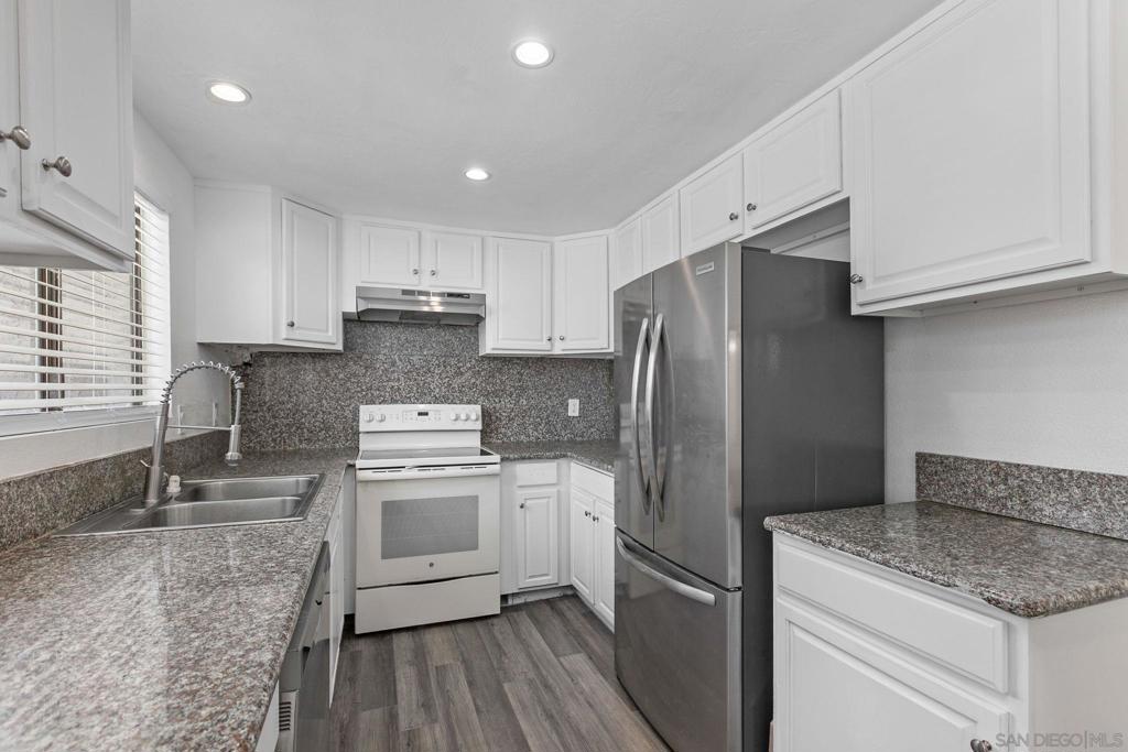 Welcome to this stylishly updated 3-bedroom, 1.5-bath end-unit townhome, offering 1,123 sq ft of well-designed living space in the heart of San Diego. This two-story gem combines comfort, functionality, and modern upgrades throughout. Step inside to find brand-new flooring, new plush carpeting, and abundant natural light. The kitchen boasts freshly refinished cabinets, sleek granite countertops, enhanced plumbing, and newer appliances—including a high-end French door Samsung refrigerator. Both bathrooms have been tastefully renovated with modern vanities, new toilets, and designer faucets. Additional features include upgraded fixtures, two dedicated parking spaces, and a private feel. Whether you're a first-time buyer or savvy investor, this turnkey home offers move-in ready convenience.
