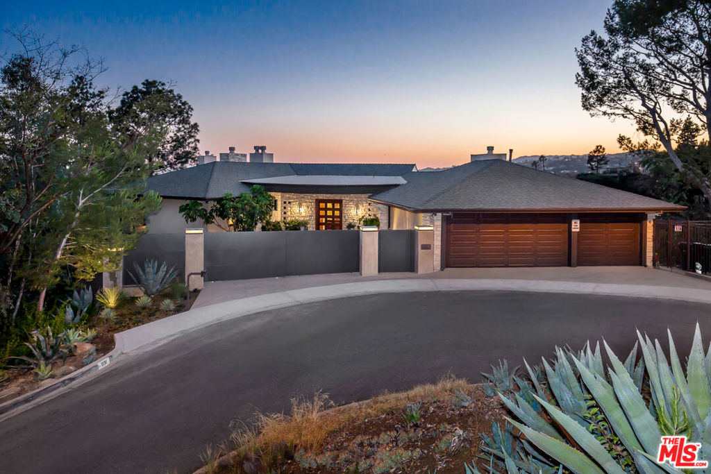 Dramatic and Secluded Contemporary with Panoramic Views. Perched on a 1-acre promontory with 280-degree unobstructed city & ocean views on one of the best and quietest streets in Beverly Hills. The 5,000+ square-foot home features a large family room and kitchen with a top-of-the-line chef's kitchen, complete with Wolf & Sub-Zero appliances, BBQ, bar, wine fridge, and walk-in pantry. The sexy living room and large-scale dining area flow out to expansive furnished terraces with city & ocean views. Spacious bedrooms include a breathtaking private master suite with exceptional wrap-around views, a spa for 2, a French limestone double shower, large walk-in closets & fridge! Additionally, there are 2 en-suite family bedrooms and 2 exceptional guest suites, each with forever views and private entrance. There are 5 dramatic fireplaces and 2 luxurious window seats. The terraces lead you out to an expansive, private, lush yard with sweeping city & ocean views, yet completely secluded. A well-appointed pool area, complete with a cabana, an alfresco dining area, waterfall and pond, chaises, and umbrellas, completes this private and coveted resort enclave.. Available in October.
