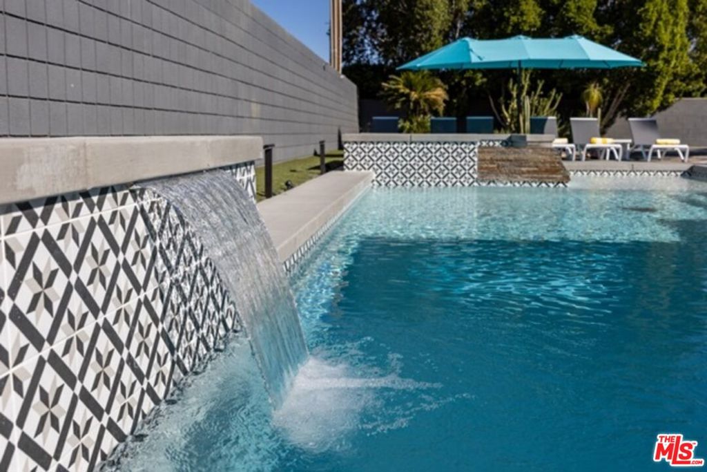 ***RATE BUYDOWN*** - SELLER TO PARTICIPATE IN 3 YEAR RATE BUY DOWN - 3% YEAR 1, 2% YEAR 2, AND 1% YEAR 3 - HUGE SAVINGS OFF MONTHLY PAYMENT FOR 3 YEARS - SEE ATTACHED DOCUMENT (this is an example, your rate may vary based on your situation) - Desert Modernism. FULLY FURNISHED Home, vacation oasis or successful SHORT TERM RENTAL investment property. Located in the highly sought after Oasis del Sol neighborhood in Central Palm Springs minutes from downtown. The four bedrooms offer comfortable living spaces, with the primary bedroom providing a serene retreat. The two bathrooms are well-appointed and designed for functionality. A bonus living room with Murphy Bed provides an option for a 5th sleeping area. The gourmet kitchen is equipped with high-end appliances, ideal for those who enjoy cooking. The indoor and outdoor living spaces seamlessly blend, creating a harmonious flow. The backyard provides an entertainer's paradise with a sparkling in-ground pool and soothing spa. The large, private lot size allows for a spacious and versatile living experience. This home has been successfully operated as a short-term rental, catering to a variety of guests seeking a comfortable and convenient stay. The home is being delivered fully furnished, for an immediate short term rental income opportunity. Showcasing a desert modernism aesthetic with casual elegance throughout, this home provides a convenient and move-in ready experience for the next owner. The flexible floor plan and versatile spaces make this property ideal for a variety of lifestyles and needs. The home is situated just five minutes from downtown, allowing for easy access to the vibrant local community. The San Jacinto Mountain views from the property provide a stunning natural backdrop, enhancing the overall appeal of the residence.
