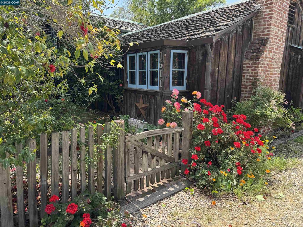 Enchanting Single-Story Carmel Cottage (1611 Carmel) + Attached Casita (1611 A Carmel) Just steps from downtown Walnut Creek, this storybook-perfect cottage blends old-world European charm with modern convenience. Welcoming front courtyard surrounded by roses, camellias, and wildflowers—ideal for morning coffee or evening wine under the stars. Inside, discover warm hardwood floors, cozy nooks, vintage built-ins, and a wood-burning fireplace. Natural light fills every corner through classic cottage windows, creating a cheerful, inviting atmosphere. Enjoy a thoughtfully updated kitchen and spacious bedrooms. Walk to the library, Broadway Plaza, over 100 restaurants, boutique shops, trails, and BART—embracing both charm and urban living. Plus, a charming attached casita with separate entrance—perfect for guests, extended family, rental income, art studio, or home office. Includes a two-car garage and two additional off-street spaces. More than a home—it’s a lifestyle. Come experience the magic of cottage living in the heart of Walnut Creek. This home has newer HVAC and updated elec Please note, Zillow shows this as two separate properties, 1600 and 1600A, each with its own valuation. This is incorrect and we are working on it. They are one parcel, and have always been that way.