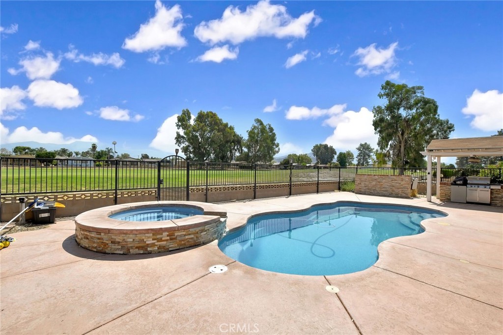 HARD TO FIND POOL HOME IN SEVEN HILLS ALSO ON THE 9TH FAIRWAY. This home has a front patio and entry way in brick laid in a beautiful herringbone pattern that leads to a gorgeous oak front door w/leaded glass insert. This floor plan features a living room and family room that share a floor to ceiling fireplace. The family room has vaulted ceilings, laminate floors and built in bookcases and is open to the kitchen and dining area which features a mirrored wall which really visually expands the space. The kitchen has tiled floors and counter as well as a breakfast bar. The living room is carpeted, has vaulted ceilings and a wet bar. The primary bedroom has mirrored closet doors and the adjacent primary bath has a walk in shower. The guest bedrooms share a full bath with shower over tub configuration. The huge back patio has a brick floor that overlooks the golf course and the salt water pool. You are walking distance to the Pro shop and restaurant for a quick popover for dinner and cocktails. There are just a handful of homes in Seven Hills w/private pools so grab this ne while you can