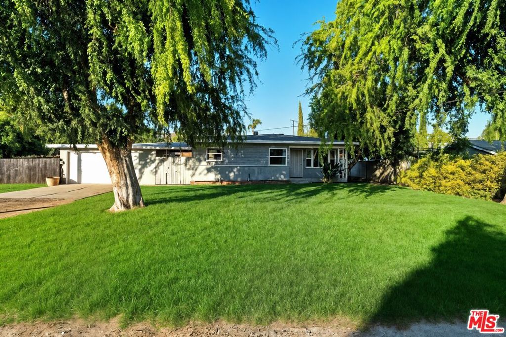 Beautifully updated and move in ready, this charming 3 bed / 2 bath Riverside home sits on an expansive 17,860 sq ft lot just shy of half an acre offering endless potential for outdoor living, RV parking, or future expansion. Inside, you'll find a bright and airy layout with updated flooring, elegant wall molding in the living and dining areas, and a remodeled kitchen with quartz countertops and stainless steel appliances. All three bedrooms are spacious, and the bathrooms has been tastefully redone. The oversized backyard is a true bonus ideal for entertaining, gardening, or even adding an ADU (buyer to verify). Additional features include central HVAC, EV charger hookup, a detached garage, and plenty of parking. Perfectly located near UC Riverside, Downtown Riverside, Galleria at Tyler, Doty Trust Park, and Kaiser Permanente Hospital, with easy access to the 91, 15, and 60 freeways. Nature lovers will love being just minutes from Mount Rubidoux hiking trails, a local favorite for walking, running, and panoramic views of the city. This one checks all the boxes!