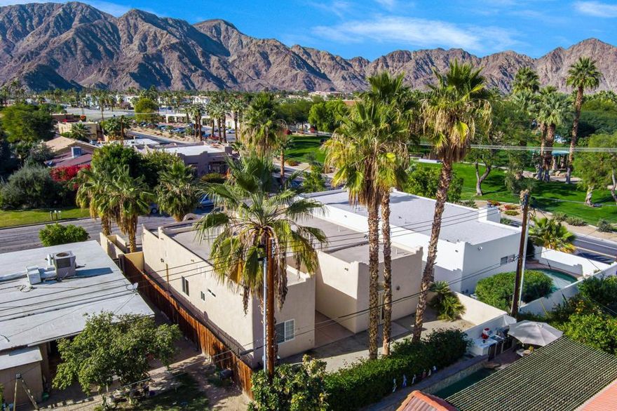 Nestled in desirable Desert Club Estates, this charming South La Quinta residence captures breathtaking mountain views and an unbeatable walk-to-everything location just moments from the restaurants, boutiques, and charm of Old Town La Quinta. Offering approximately 1,502 sq. ft. of open and inviting living space, this single-family home features 3 bedrooms, 2 bathrooms, a separate laundry room, and attractive architectural accents throughout. A welcoming front courtyard with lush grass presents exciting potential for a private pool and/or spa, creating your own desert oasis. Inside, enjoy a cozy tile-surround gas fireplace with glass doors and built-in bench seating, perfectly anchoring the living space. The adjacent dining area flows seamlessly into the kitchen, complete with tile countertops and backsplash, gas range, built-in microwave, generous cabinetry, walk-in pantry, and convenient bar seating. The primary suite is a peaceful retreat with French doors and a transom window, offering an en-suite bath with dual vanities, tile counters, a spacious shower, and a walk-in closet. A wonderful opportunity to own a well-located La Quinta home--schedule your private showing today.