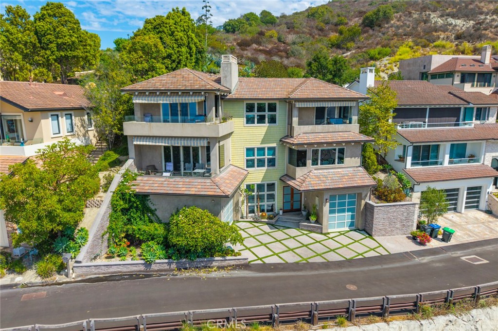 Welcome to 6 Pacific Vista, Laguna Beach, CA
Nestled on a peaceful cul-de-sac in one of Laguna Beach’s newer neighborhoods, 6 Pacific Vista offers the perfect balance of serenity and coastal convenience. Perched high above Woods Cove, this exquisite residence captures sweeping, unobstructed views of the Pacific Ocean, Catalina Island, and Laguna’s picturesque coastline—all while being just a short stroll to two of the area’s most beloved beaches: Woods Cove and Moss Point.
Built in 2006 and spanning nearly 4,000 sq. ft. of living space, the home seamlessly blends old-world charm with modern luxury. The thoughtful floor plan showcases four spacious bedroom suites, each with its own private bath. The primary suite is a true retreat, featuring dual sinks, a soaking tub, and access to a private terrace where you can soak in panoramic sunsets.
At the heart of the home is an oversized chef’s kitchen, complete with high-end appliances, a large center island, and a combined pantry and laundry room with direct access via the main floor elevator. The open-concept dining area and family room, framed by one of three cozy fireplaces, create a warm and inviting space for gatherings—whether intimate dinners or larger celebrations.
Multiple terraces extend the living experience outdoors, offering breathtaking vantage points for entertaining or quiet relaxation. An outdoor patio above the home provides the perfect setting for alfresco dining or weekend barbecues under the stars.
Additional highlights include an attached two-car garage plus 2–3 more parking spaces, generous storage, and a spacious 8,000+ sq. ft. lot.
6 Pacific Vista is more than a home—it’s a coastal sanctuary designed for those who value luxury, tranquility, and the unmatched beauty of Laguna Beach.