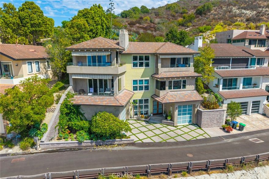 Welcome to 6 Pacific Vista, Laguna Beach, CA 

Nestled on a peaceful cul-de-sac in one of Laguna Beach’s newer neighborhoods, 6 Pacific Vista offers the perfect balance of serenity and coastal convenience. Perched high above Woods Cove, this exquisite residence captures sweeping, unobstructed views of the Pacific Ocean, Catalina Island, and Laguna’s picturesque coastline—all while being just a short stroll to two of the area’s most beloved beaches: Woods Cove and Moss Point.

Built in 2006 and spanning nearly 4,000 sq. ft. of living space, the home seamlessly blends old-world charm with modern luxury. The thoughtful floor plan showcases four spacious bedroom suites, each with its own private bath. The primary suite is a true retreat, featuring dual sinks, a soaking tub, and access to a private terrace where you can soak in panoramic sunsets.

At the heart of the home is an oversized chef’s kitchen, complete with high-end appliances, a large center island, and a combined pantry and laundry room with direct access via the main floor elevator. The open-concept dining area and family room, framed by one of three cozy fireplaces, create a warm and inviting space for gatherings—whether intimate dinners or larger celebrations.

Multiple terraces extend the living experience outdoors, offering breathtaking vantage points for entertaining or quiet relaxation. An outdoor patio above the home provides the perfect setting for alfresco dining or weekend barbecues under the stars.

Additional highlights include an attached two-car garage plus 2–3 more parking spaces, generous storage, and a spacious 8,000+ sq. ft. lot.

6 Pacific Vista is more than a home—it’s a coastal sanctuary designed for those who value luxury, tranquility, and the unmatched beauty of Laguna Beach.