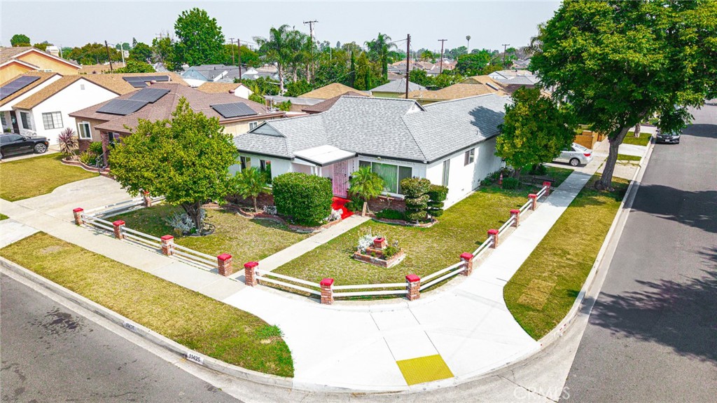 A charming three-bedroom, two-bathroom home nestled on a desirable corner lot in Norwalk, conveniently located near Cerritos College. This beautiful property offers lots of trees, a spacious and inviting floor plan, perfect for comfortable family living. Upon entering, you'll be greeted by a generously sized living room, good size bedrooms, large open kitchen, a spacious family room with high ceilings, creating an airy and open atmosphere. A two-car garage offers convenient parking, and a bonus room with its own bathroom (while currently unpermitted) provides flexibility for a home office, guest suite, or other uses. The possibilities are numerous! This home also features a lovely backyard with a covered patio, providing a private outdoor oasis perfect for enjoying the peaceful surroundings. Its convenient location near shopping centers and freeways ensures easy access to all that Norwalk and the surrounding areas have to offer. This truly is a must-see property!!! Please contact me to schedule a showing at your earliest convenience.