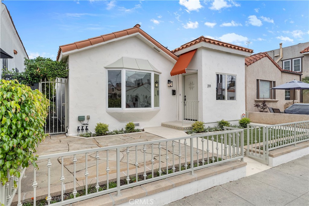 Welcome to this rare gem situated on one of the most charming and sought-after blocks in Belmont Shores. This beautifully remodeled Spanish-style bungalow features a spacious layout with soaring ceilings and tons of natural light. This property features 2-bedrooms, 1-bathroom, with 1-car garage, plus a remodeled kitchen and bath with ample storage. Enjoy both a front yard and a private, professionally landscaped backyard with stone patio space —ideal for entertaining. Located on one of the most desirable blocks in the Shore, just steps to the beach, 2nd Street shops, restaurants, and award-winning schools. Turnkey and move-in ready!