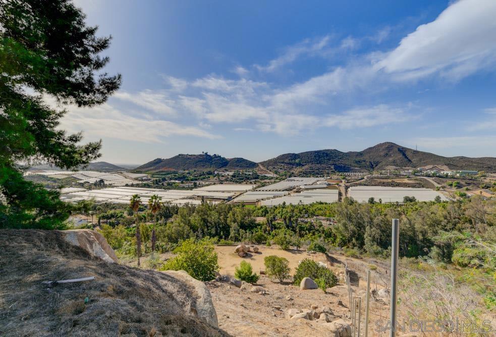 This property presents an incredible opportunity for a buyer with vision and a passion for land ownership. Located in a prime area with sweeping panoramic views, this lot offers stunning vistas of nearby vineyards, farms, horse ranches, and surrounding mountain ranges. Ideal for those seeking privacy and natural beauty, the land is well-equipped with key amenities including A water well that was installed in 2015, providing metered water for the property. Previously used as a grove, the land offers a strong foundation for agricultural pursuits or other ventures. A 1,000-gallon septic tank and leach field are in place, with finalization required to complete the setup. Zoned A70 and S92, the property has two flat pads that are ready for development or additional uses. Access to utilities is facilitated by an SDGE easement that runs from the main road, while a pipeline easement runs along the west side of the lot. The animal designation code M allows for small animal raising and permits up to 2 horses per 1.5 acres. This property is a blank canvas for a buyer with the right imagination, ready to take advantage of the unique potential it offers. Buyer & Buyer Agent to verify all information herein prior to submitting an offer.