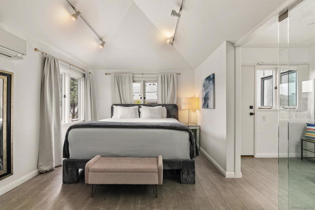 Welcome to your perfect coastal retreat! This elegantly designed luxury studio offers a comfortable king bed and a relaxing sitting area, bathed in natural light from a beautiful skylight. Just steps away from the ocean, this serene escape provides everything you need for a peaceful getaway. Enjoy the convenience of a mini fridge and microwave, perfect for light meals and snacks, along with a private bathroom with a walk-in shower for ultimate comfort. Whether you're sipping coffee while soaking in the coastal breeze or unwinding under the skylight, this bright and airy space is designed for relaxation and luxury.