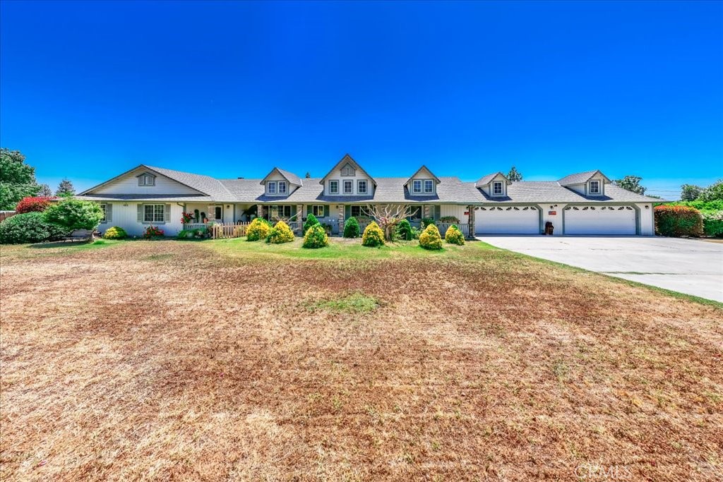 Country home on a spacious half-acre lot, featuring two primary suites for ultimate flexibility. This 5-bedroom, 3-bath residence offers an open-concept floor plan, a generous 4-car garage, and mature landscaping. Conveniently located near Madera Country Club with easy freeway access, ideal for comfortable living and effortless commuting