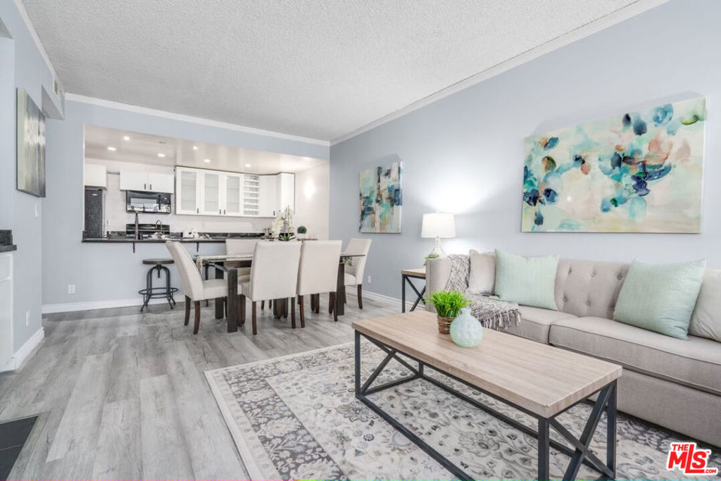 Welcome to this EXTRA-large 1-bedroom, 1.5-bathroom condo in the heart of Westwood Village, located on a picturesque tree-lined street! Bright and spacious, this unit is perfect for entertaining, featuring an open-concept kitchen with an abundance of counter space and cabinetry, a breakfast bar, dining area, expansive living room, wet bar, and cozy fireplace. One of the standout features is the enclosed patio, separated by glass doors. Ideal as a bonus room for a home office, playroom, or creative space, offering flexibility to suit your lifestyle. Retreat to the oversized master bedroom oasis, complete with an ensuite bath and a huge walk-in closet that offers exceptional storage space. Additional highlights include plantation shutters throughout, an in-unit stackable washer and dryer, and secure, well-maintained grounds. Located in a boutique 16-unit building with a pool and spa, this rare find offers the perfect blend of comfort, functionality, and convenience in one of LA's most sought-after neighborhoods.