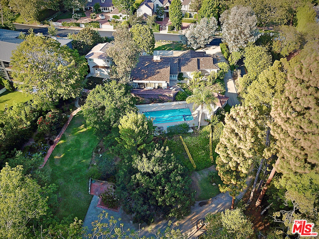 Located in one of the most highly sought after guard-gated communities in all of Los Angeles. A rare opportunity to remodel, add-on or build your dream home on over an acre of private, park-like grounds in Brentwood Circle. A truly rare offering - this property has not transferred ownership in over 60 years! An adjacent additional land beyond the public records includes a dry stream running along the west side of the property, adding to the nostalgic charm of this unique property.