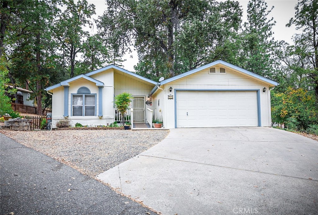 Check out this 3-bedroom, 2-bath home that sits on a spacious corner lot in one of Oakhurst’s most sought-after 55+ communities, The Grove. It’s one of the rare homes in the park set on a permanent foundation with an attached garage!
The open-concept layout is bright and inviting, with plenty of natural light. The brand new wood plank flooring that adds warmth and style. Outside, the back and side yards are fully fenced, and a large Tuff Shed offers extra storage.
Step outside and enjoy your peaceful surroundings from the large back porch. Homes like this don’t come around often, so schedule your private showing today!