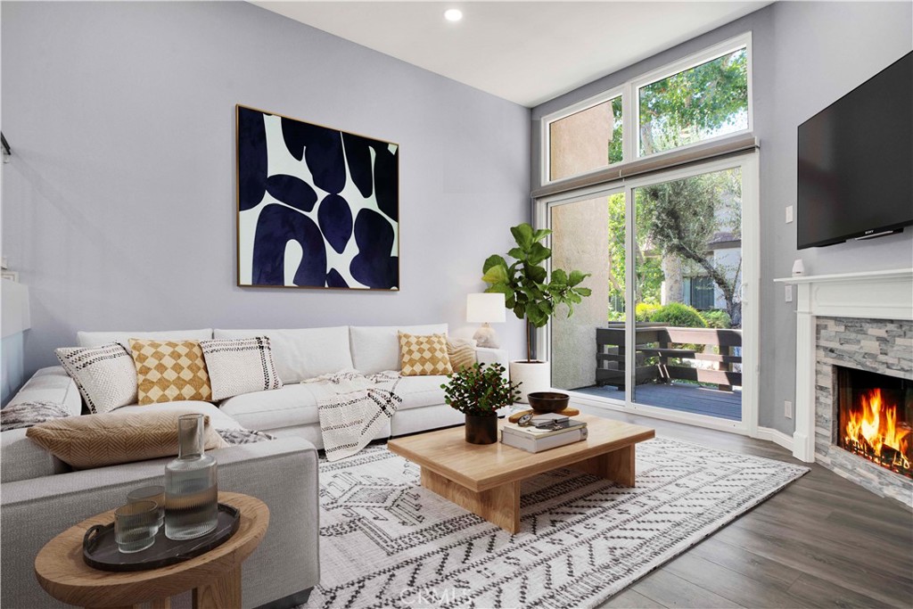 Feels less like a rental and more like a home! Welcome to this gorgeously remodeled Northbrooke townhome! The unit boasts 2 large suites, 3 baths, private 2 car garage, and is tucked deep within the complex, entering through the treelined walkways, alongside the flowing water feature. This light & bright tri-level home has an open floorplan with vaulted ceilings & clerestory windows that bring in natural light throughout the day. Stylish combinations of modern elegance from the chic chandelier in the 2 story entry; to the sleek stainless steel appliances, quartz countertops & marble subway backsplash in the kitchen; with classic backdrops of paint color throughout the home to compliment any design. Modern features include: smooth ceilings, recessed lighting, custom zebra blinds & luxury vinyl plank flooring throughout. Upgrades include: brand new dual pane windows & whole-house water filtration system. The spacious lower level living room has a corner fireplace with stone tile & wood mantle. Enjoy coffee, drinks or entertaining on the lush patio-- which sits above the green space path & shaded by surrounding trees. The upper living-dining room & kitchen level has a built in coffee/bar with sink & additional built-ins in the dining area offer abundant storage options. This flex space level is large enough to have an extra sitting area, which makes it great for entertaining. The huge primary suite has a treetop view, accent wall, desk niche, modern ceiling fan/light, an extra large closet & a secondary closet. The spa-inspired primary ensuite features dual vanities, glass enclosed rainfall shower & handheld fixtures, high end tile finishes with corner bench seat, & brushed nickel hardware. The guest suite has large closet & a full size ensuite. This secondary bath features classic subway tile surround, waterfall & handheld fixtures, modern vanity & lighting with brushed nickel hardware. Enjoy resort-style amenities, including a sparkling pool, garden jacuzzi, tennis courts, meandering water features, guest parking. Located in the heart of Northridge-- easy freeway access for commuters; minutes from Porter Ranch, CSUN, Northridge Fashion Center, Porto's Bakery, Costco & MORE! Great opportunity to rent this townhome; it feels more like a home in a nice neighborhood-like community.