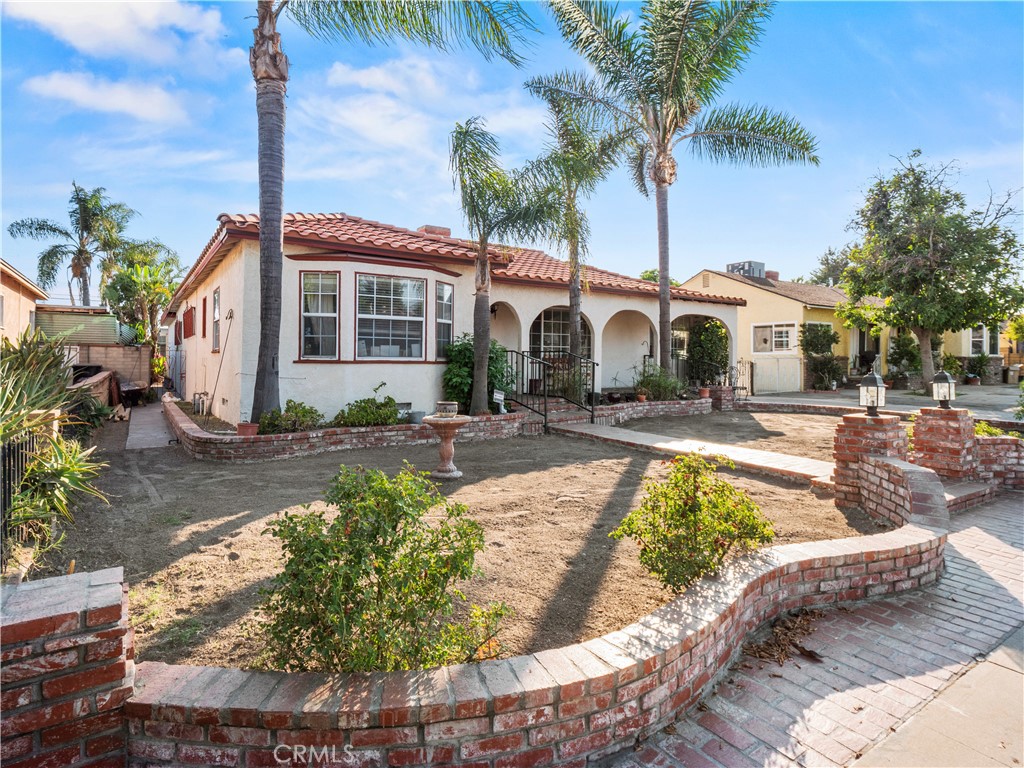 Spanish style home in the heart of Arleta. Walk into a spacious living room with tile flooring, double sided chimney. Both bathrooms have been updated. Second living room has a wet bar to entertain guests. Main house has a bonus room that can be used as an office. As you step out to the patio you're greeted by a breathtaking fountain. As you make your way further towards the backyard you're welcome to a crystal clear pool. Also at poolside there's another bonus room that can be converted into an ADU. There's also a detached garage that can also be converted. Huge RV parking and more. Possibilities are endless. It's a must see !!