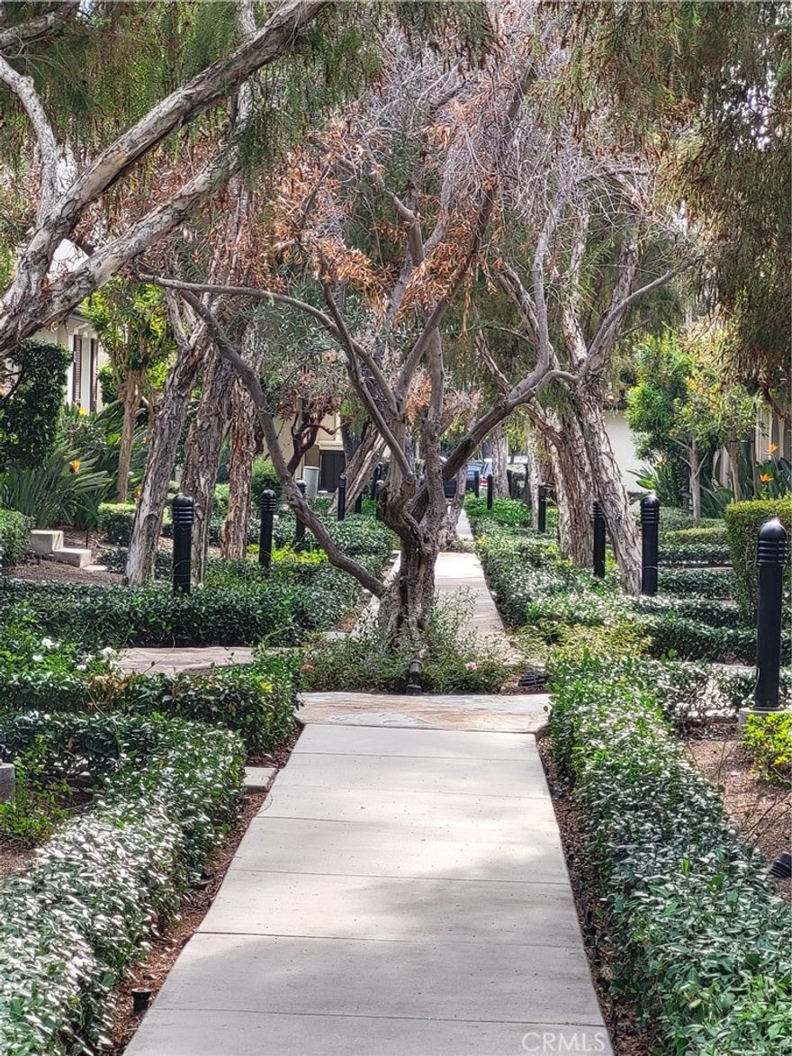 If you're looking for a home in a great neighborhood, with lots of trees and gated, this is it! The Great location of Irvine Cypress Village community. The most popular plan comes with downstairs main bedroom with full bath and walk in closet. The spacious living room has a fireplace. There's a dining nook, and gourmet kitchen with contemporary cabinetry, beautiful countertops, backsplash and a large kitchen island. Beautiful tile, and wood fooring with carpet in the bedrooms for the coolder nights. Upstairs features a bonus room plus 2nd primary bedroom plus a 3rd bedroom,.The 2nd floor primary suite with spa-like bathroom: dual sinks, large step-in shower, and walk-in closet. Enjoy the private patio space for entertaining and BBQs. Top shelf Cypress Village amenities include private community parks, Jr. Olympic pools, jacuzzies, tot lots, and award-winning schools Cypress Elementary and Jeffrey Trails Middle school. Just moments away to the Great Park, Irvine Spectrum, Woodbury Town Center, Cypress Village Shopping Center, and 5 Freeway.