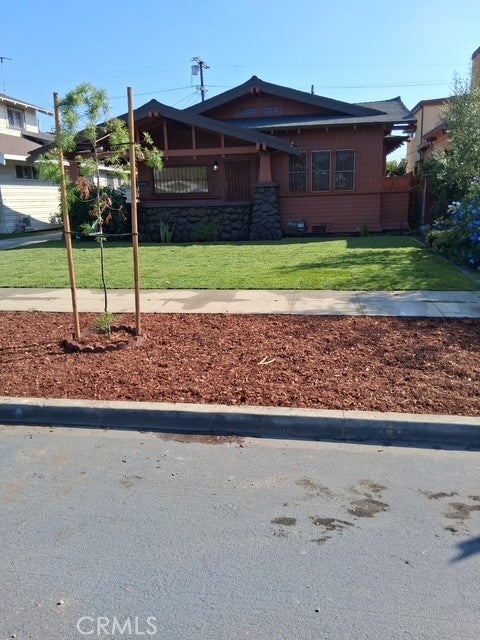 Photo of 1842 W 43rd Place, Los Angeles, CA 90062 (MLS # IN26183345)