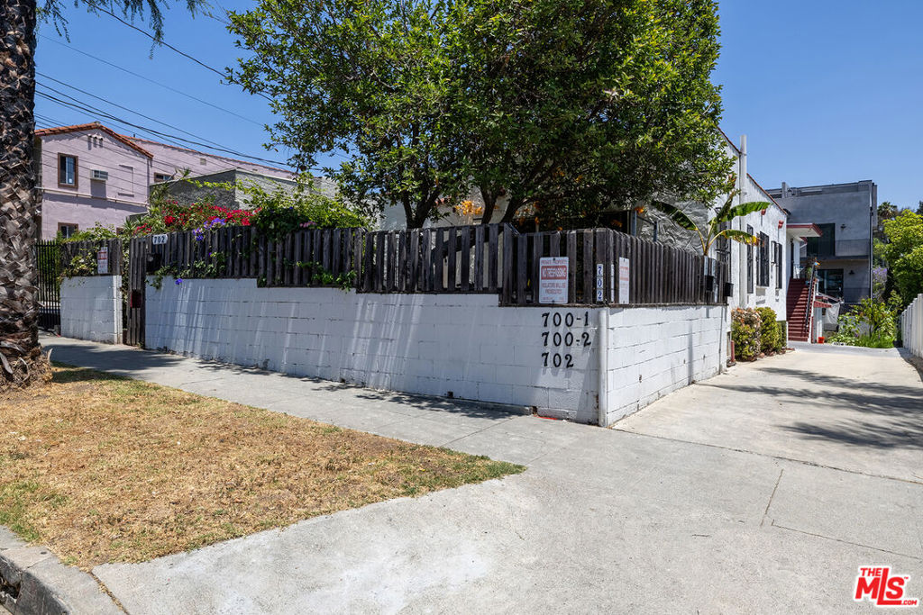 Outstanding investment opportunity in the heart of Silver Lake just blocks from popular Sunset Junction. This versatile triplex consists of a single-family front house and duplex in the rear, ideal for an owner/user seeking passive income or for investors looking for a high demand location. The front unit is a charming Spanish-style 3BR/1BA home with 1,216sf featuring original hardwood floors, spacious living room, formal dining room, remodeled bathroom with dual sinks and private backyard. There is potential to add a second bathroom to the house. Behind the front house is a detached 2-story duplex with two 2BR/1BA units at 575 sq ft. each. The entire triplex is being delivered with tenants that are all month-to-month and has great upside potential. The large lot offer possible expansion (buyer to verify). Gated and secure with driveway and parking for four cars, the property is located minutes from cafes, shops, major transit and one mile away from the Silver Lake Reservoir running trail, picnic area and dog park. With an array of eclectic boutiques, artisanal bakeries, and world-class dining just around the corner, this property places you in the heart of it all. Whether you're looking to add to your portfolio or occupy one unit while generating income from the others, this is a rare chance to own in one of L.A.'s most in-demand rental markets.