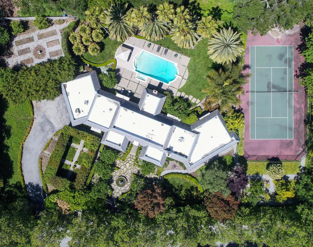 Incredible cul-de-sac location in West Atherton-the country's most exclusive zip code-is the setting for this property that awaits your vision for the future. At one time, a glamorous country estate with a backdrop of Canary palms, the home boasts a pool, spa and tennis court. Grand entertaining spaces with formal living and dining rooms, family room plus dedicated study. Each bedroom is en suite with garden views. This rarely available property surrounded by impressive estates, offers an outstanding opportunity to renovate, expand or build new-rare to have property with tennis court. Excellent Las Lomitas school district, easy access to HWY 280, Sand Hill Road, Stanford University, shopping and restaurants.