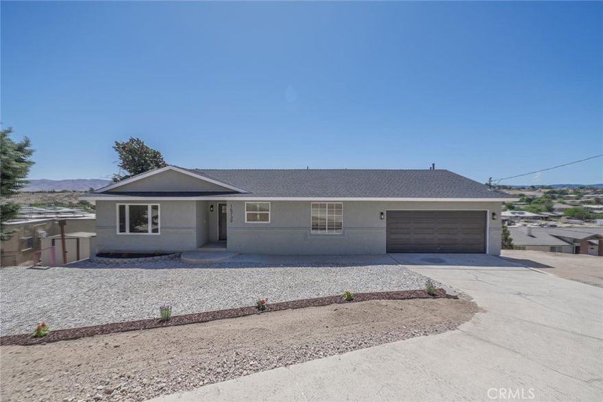 This home qualifies for the exclusive NAF Pathway Program, offering a reduced interest rate, no mortgage insurance, and up to $8,000 in buyer assistance—a rare chance to lock in major savings on a beautifully updated, move-in-ready property. Step inside to discover fresh interior and exterior paint, brand-new laminate flooring, plush bedroom carpeting, and tile bathrooms enhanced with modern recessed lighting. The fully renovated kitchen showcases all-new cabinetry, a stylish backsplash, updated faucet and garbage disposal, floating shelves, and brand-new stainless-steel appliances. Both bathrooms have been thoughtfully upgraded with new vanities, mirrors, fixtures, and lighting, while the primary suite boasts a custom walk-in shower. Additional highlights include new baseboards, closet doors, ceiling fans in every bedroom, and a striking fireplace surround in the living room. As a bonus, the property features a versatile basement/workshop area—ideal for storage, a home gym, creative studio, or potential ADU conversion. Outside, low-maintenance landscaping keeps the yard clean and easy to enjoy. This turnkey home truly checks all the boxes—don’t miss out on this rare opportunity!