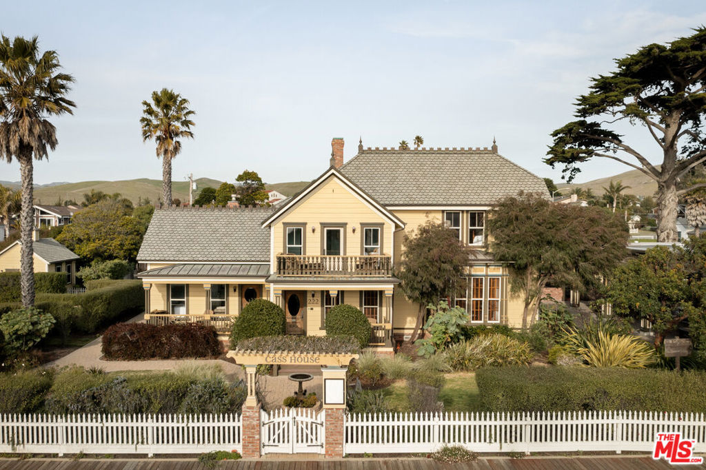 A Landmark Investment Opportunity: The Historic Cass House. A turnkey opportunity to own a charming Bed & Breakfast, Artisanal Bakery, stylish Bar & Grill, and versatile Wedding & Event Venue. Own a piece of Cayucos history with this exceptional investment opportunity. This historically significant estate encompasses two combined APNs: 222 N. Ocean Avenue & 149 Cayucos Drive, Cayucos, CA. The Iconic Cass House, established in 1875 by town founder Captain James Cass, is a landmark property located in the heart of downtown Cayucos, just one block to the ocean and a short drive from Morro Bay and the Madonna Inn. This estate, approximately 30,000 sq ft (0.68 acres) is zoned for commercial, offering opportunities for hospitality or private residential purposes. This property offers a unique blend of existing improvements and diverse development potential. The Cass House, originally priced at 5 million more than a decade ago, was acquired in 2014 for 2.5 million. Substantial investments were made to redevelop the property, including the addition of new structures like a bar & grill, bakery, outdoor pavilion, storage, restrooms, and parking facilities. Throughout the development process, the property's original architecture was carefully preserved to ensure its charm and character were maintained. This project required dedication and passion to bring to fruition. The property boasts four distinct structures, including the renowned Bijou Bakery. The meticulously restored 1876 main residence exudes historic grandeur in a Victorian architectural style. Each bedroom has its own ensuite bathroom, and there are various amenities such as a reception area, banquet room, formal dining room, and a commercial-grade kitchen perfect for its previous operation as The Cass House Bed & Breakfast and Wedding Venue. A picturesque wedding arbor and expansive lawn provide an idyllic setting for events. Currently used as a private residence, this grand estate awaits its next chapter as a premier destination. Complementing the main residence is a guest house, ideal for on-site management, additional guest accommodations, or a bridal suite. Further enhancing the property are a cold storage unit designed to seamlessly blend with the historic aesthetic, a dry storage area, public restrooms, on-site parking, and established vegetable and herb gardens, offering exciting farm-to-table possibilities. The fully equipped restaurant space, formerly the Cass House Bar & Grill, is primed for reopening. Featuring multiple beer and wine taps, a wood-fired oven and Argentina grill, a professional-grade bar and kitchen, and an inviting alfresco dining pavilion with retractable covers, ample seating, and elegant chandeliers, this space is perfectly suited for a thriving restaurant and wine events. The Bijou Bakery currently operates under a month-to-month lease, providing the new owner with flexibility to renegotiate terms, secure a long-term lease, or explore alternative arrangements. This highly visible property enjoys a prime location, attracting both locals and tourists. Its unique combination of historical significance, proximity to the ocean, versatile zoning, existing infrastructure, and potential for expansion makes this a truly compelling investment in a thriving coastal community. Please insert the following link into your web browser for the video illustrating the property's immense potential: https://youtu.be/fmsG-Sl8jLg?si=ZNo0WGNWeAEGEoH1 . Financials and pro forma details available upon request. Contact our team today for more information or to schedule a private showing.