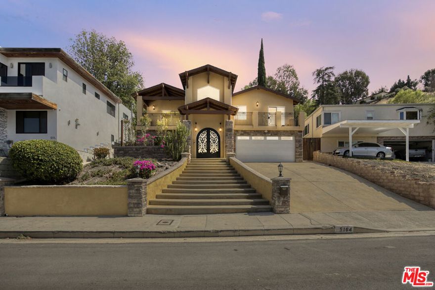 Welcome to your next home at 5164 Don Pio Drive, a refined Tuscan-style residence that blends classic elegance with modern updates. Bursting with curb appeal and nestled on a quiet hillside, this 4-bed, 3-bath gem sits on a spacious 8,000 sq ft lot, offering tranquility, privacy, and sweeping views of the lush San Fernando Valley landscape.Impressive entrance with ornate steel double doors opens to a grand staircase to the main level that opens into living area with high ceilings, balcony with view, dual fireplace shared with the formal dining room. Fully equipped kitchen with granite countertops includes an eat in island. Additional dinning area adjacent to kitchen opens up to expansive shaded patio and terraced back yard.Main level features powder room off of the kitchen, expansive primary suite, jacuzzi tub, walk in custom closet, private balcony with view. Two more bedrooms on this level with guest bath off main hallway.The lower level features an additional bedroom with private en suite bathroom with access from main stairwell as well as additional exterior private entrance through French doors and private patio. Full laundry room with sink and cabinets located on lower level. Attached 4-car garage with access through the main stairwell.Prime Woodland Hills LocationNestled at the foothills of the Santa Monica Mountains, Woodland Hills is celebrated for its blend of natural beauty, peaceful living, and convenient access to city amenities.Close to vibrant Ventura Boulevard, where cafes, restaurants, boutiques, and entertainment venuesOutdoor recreation abounds:Upper Las Virgenes Canyon Open Space Preserve offers miles of hiking, biking, and equestrian trails.Nearby Serrania Park features shaded walking paths, picnic spots, and a playground. Warner Center Park, a local favorite for picnics and seasonal events, is just a short drive away.The expansive Woodland Hills Recreation Center (Shoup Park) includes sports fields, courts, a swimming pool, and playgrounds.MoveGreenFor sweeping views, the Top of Topanga Overlook offers panoramic sights of the hills and valley.