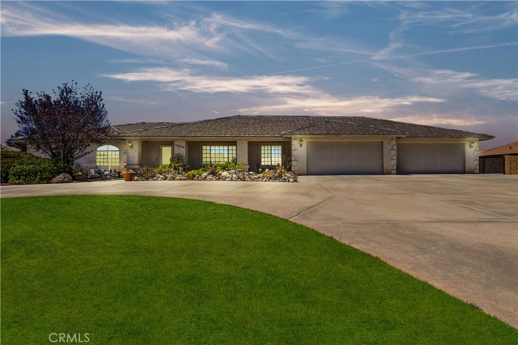 Discover a rare opportunity in the prestigious, gated Quail Run Estates—where homes are cherished and listings are few and far between. Situated on over half an acre, this stunning 4-bedroom, 3-bathroom single-story home offers more than 3,000 sq ft of beautifully designed living space. From the moment you arrive, you're greeted by a serene custom-built front pond—an eye-catching feature that sets a tranquil, luxurious tone for the entire property. Inside, the home boasts a thoughtful split floorplan with two master suites, soaring vaulted ceilings, and custom touches throughout. The formal living and dining rooms flow effortlessly into a spacious family room with a fireplace—ideal for entertaining or cozy nights in. The home also features a beautiful gourmet kitchen. Step outside to enjoy expansive patio areas and plenty of room to relax or entertain. A 4-car finished garage, RV parking with gated access, and an indoor laundry room complete the home’s exceptional functionality. Located in one of Apple Valley’s most sought-after communities, this home truly has it all—privacy, style, space, and a unique blend of comfort and elegance. Homes in this neighborhood rarely become available, making this your chance to own a piece of paradise. Don’t miss out—this is the lifestyle upgrade you’ve been waiting for.