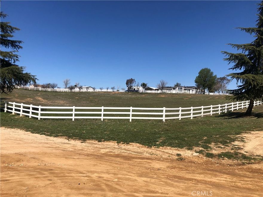 17.59 Acres. Incoming Development The Cross Roads Project. For Investors or Developers. 3 homes on the property. Main home is 3 bedrooms with an office and 3 bathrooms. Large family room, Living room with fire place. Formal Living room and dining room. Kitchen with breakfast bar and breakfast room and walk in pantry. Laundry room. Large patio and garden area outside. 2 car garage. 2nd home 3 bedrooms 2 bathrooms. Nice size living room with fire place, dining room, kitchen and laundry room. Small home with 1 bedroom and one bath. patio and dethatched laundry room. 40 X 80 huge steal building with 2 floors on the sides. Sports Bar, commercial sink, Office and 3/4 bath. Wood burning stove. Tool Room. Upstairs plenty of storage and one side has an extra living area. ( used to be used as a Family Owned truck Company & repair shop and still could, has a commercial meter.) Also Laundry area w/ washer & dryer in shop. Loads of truck parking. Pole barn for parking RV's and ATV's or anything else needed. Good size Storage shed with built in air compressor next to steal building as well as a sunk in ground reefer trailer for storage. ATV's or horses tons of off road trails. Cows, horses and all animals welcome. Full pig pen built in. Deep fire pit to roast turkeys. White rail fencing the entire property. Gorgeous scenery from all directions and not far from the City for shopping. Freeway just minutes away with under pass. solar panels. RZR Trails. Corner property runs from Bobcat Rd. to Hill Top Drive( an additional 20 Acres next door available for almost 40 Acres) Also just South of New Crossroads Project.