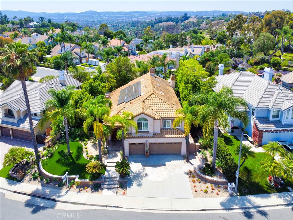 *A Tranquil Suburban Oasis*
Freshly painted and move-in ready, this beautifully crafted four-bedroom home with a spacious loft offers the perfect blend of comfort, style, and serenity. Outfitted with 32 fully paid-off solar panels, it delivers modern energy efficiency without compromising on luxury.
Set in a peaceful neighborhood surrounded by lush trees, the property boasts a tropical garden designed for relaxation, complete with a soothing waterfall and a sparkling saltwater pool, creating a private resort-style retreat. Inside, rich hardwood floors and travertine tile accents add warmth and elegance to the main living areas.
The versatile loft provides space for a home office, playroom, or creative studio, adapting effortlessly to your lifestyle. From quiet moments in the garden to cozy evenings indoors, this home offers a rare opportunity to enjoy nature and elegance in perfect harmony.