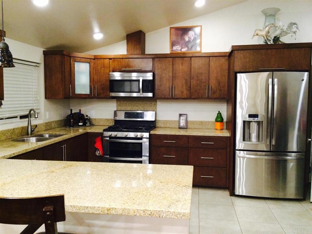 House and ADU were recently totally remodeled. Front house is 1 Bedroom 2 Baths, has spacious kitchen, newer cabinets, granite counters, stainless steel appl, newer windows & doors, newer light fixtures, tile floors in kitchen & baths. ADU is 2 Bedrooms 1 Bath with all tile floors. Permits unknown for ADU. Seller purchased prop with 2 units. Sale does not include land without concrete, that is a separate parcel. Buyer and Agent to verify all information including but not limited to building permits, condition, square footage, etc. Both units are tenant occupied.