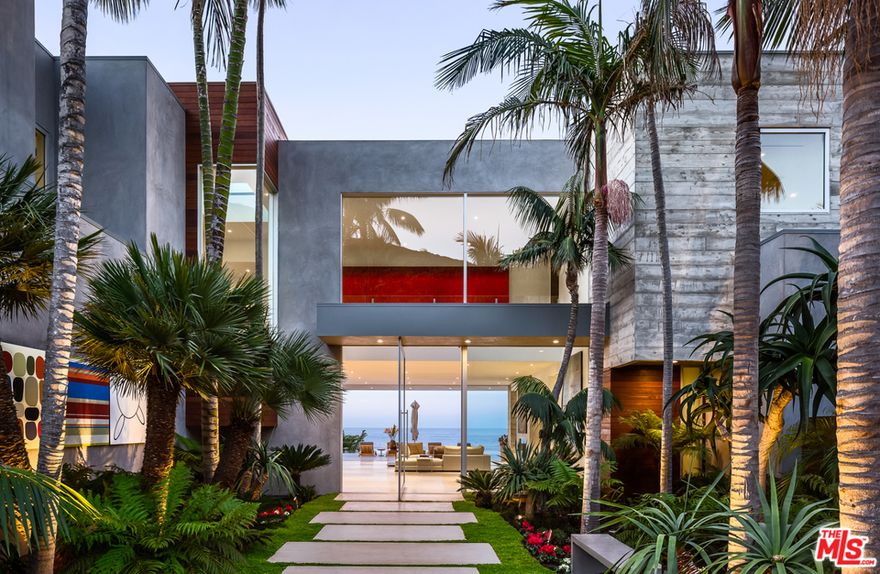 Located on the oceanfront bluffs of the exclusive MariSol community, this unbelievable modern home graces Malibu w/ amazing whitewater & island views.  Just a short drive from Santa Monica via scenic highway 1 & conveniently adjacent to the private jet center, this 7bd, 11ba home will truly appeal to the most discerning buyers.  The dramatic entrance is flanked by tropical landscaping & art that reveals wide walls of glass opening out to a stunning infinity pool.  This jaw-dropping home also includes your own private sandy beach, roof-top putting green, outdoor cabanas, movie theater & gym.  Most contemporary homes rely on bold forms & stark spatial relationships; this home dares to peel back its silky skin to reveal muscular board formed concrete walls to remind the visitor that at its heart, this home is a structure for living & not just a sculpture to inhabit. As soon as you pass through the gates you'll discover this world of privacy & tranquility - your own personal paradise.