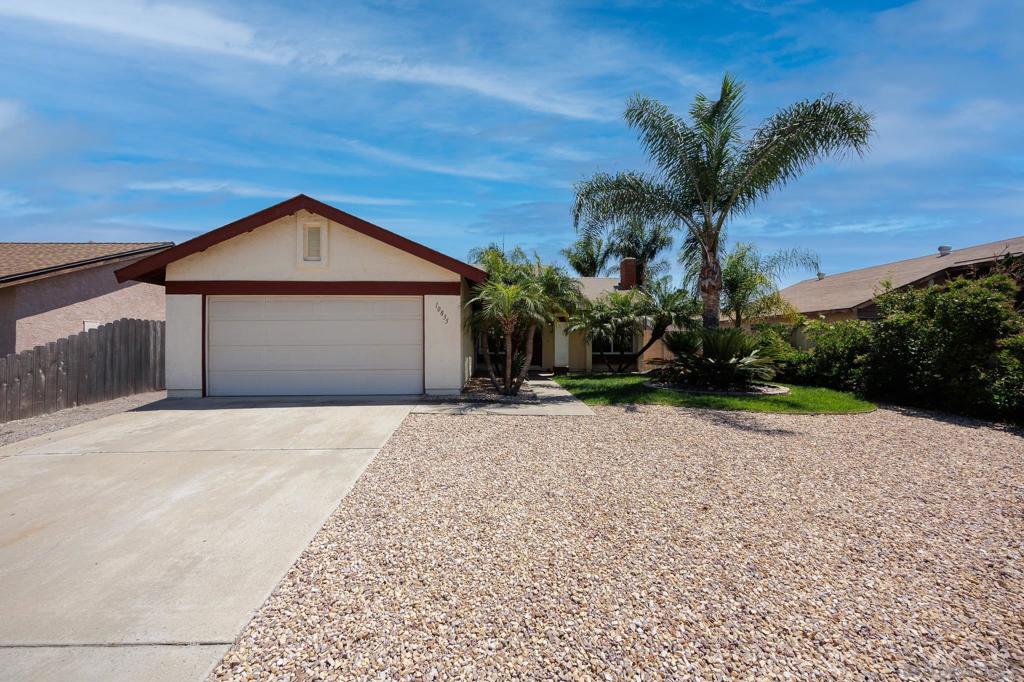 Welcome to your slice of sunny Santee — where comfort, style, and lifestyle come together. Tucked into one of East County’s most desirable neighborhoods, this beautifully updated 3-bedroom, 2-bathroom home offers a perfect blend of indoor-outdoor California living. With 1,025 square feet of smartly designed space and a flowing open floorplan, it’s as functional as it is inviting. Step outside to your private oasis: a backyard built for both relaxation and entertaining. See Supp... Picture evenings around the built-in gas fire pit, a garden ready for your homegrown produce, and a brand-new patio cover complete with outdoor fans, electrical, and ambient lighting. The mix of lush grass, pavers, and mature palm trees creates the perfect backdrop for hosting friends — or just enjoying a quiet sunset. Inside, you’ll find dual-paned windows, recessed lighting, and thoughtful updates that make this home truly move-in ready. The attached two-car garage offers convenience and storage, while the curb appeal is boosted by manicured landscaping that sets a warm, welcoming tone. And when it comes to location — this one checks every box. Just minutes from Walker Preserve Trail, Sportsplex, Santee Town Center, and an abundance of dining, shops, and top-rated schools (including Santana High), you’ll feel connected without feeling crowded. This isn’t just a home. It’s a lifestyle upgrade. Come see for yourself.