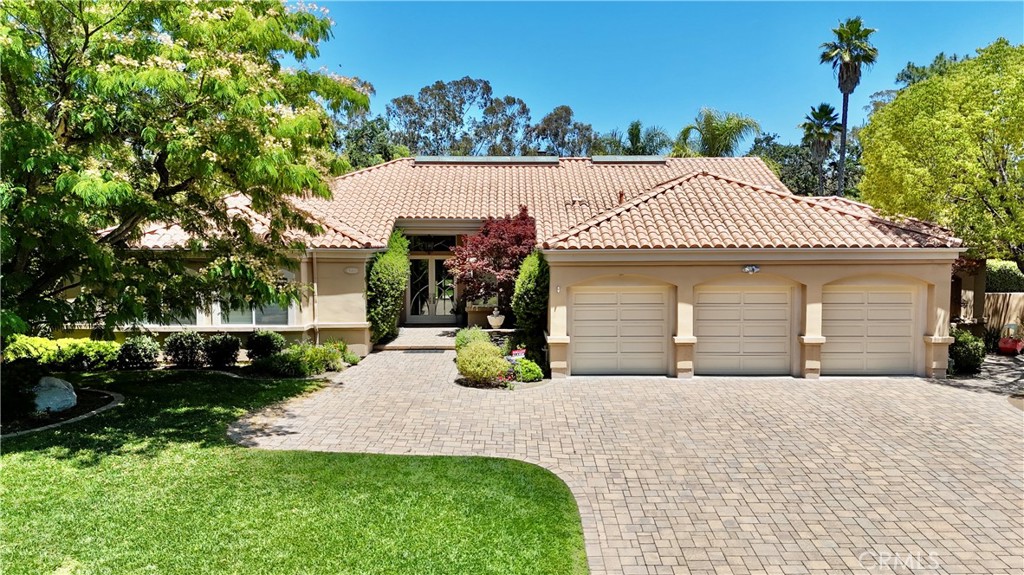 Set in a quiet cul-de-sac in the coveted Westlake Trails, this rare one-acre single-story estate offers the kind of luxury lifestyle that few ever attain. With its timeless architecture and highly functional layout, this Central Westlake property seamlessly blends elegance, comfort, and resort-style living, just minutes from everything, yet feeling a world apart. Step into an expansive open floor plan featuring vaulted ceilings, rich natural hardwood floors, custom tile, and stunning natural light throughout. The gourmet kitchen is a showstopper, anchored by an oversized island, granite countertops, and high-end finishes—perfect for entertaining or quiet evenings at home. The primary suite is truly a retreat, offering a spacious layout, a large walk-in closet, a spa-inspired bath with an oversized shower and soaking tub. Down a private wing, two generously sized guest bedrooms offer peace and separation for family or guests. Outdoors, enjoy an authentic resort experience, featuring a pool, spa, BBQ kitchen, sports court, and wide-open space with endless potential—perfect for room to expand, build, or redesign to suit your vision. Opportunities like this are scarce. This is not just a home—it’s a lifestyle reserved for those who demand the best of Westlake Village. Seconds away from the Landing at Westlake Lake, where you can dock your boat, fish, enjoy fine dining restaurants, and world-class shopping. Enjoy the Southern California lifestyle that most dream of.