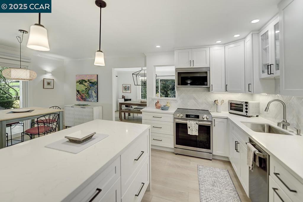 Discover this stunning remodeled COOP in one of Rossmoor’s most enchanting settings—nestled beside a peaceful creek and scenic walking path at the end of the building for added privacy. With over 1,400 square feet, this spacious home is filled with surprises and special features, like a new heating & air system, that make it truly one-of-a-kind. Expansive windows and sliders line the walls, flooding the home with natural light and framing beautiful views of nature. Step outside to a large tiled patio—perfect for entertaining guests or enjoying tranquil mornings with your coffee. You’ll fall in love the moment you step inside. A two bedroom two bathroom with bonus room and inside laundry, stainless steel appliances, new cabinets, quartz counters and unique design. Located in Rossmoor 55+ gated community with amenities and facilities that have something for everyone. From Golf, swimming, pickleball, lawn bowling, bocce ball, hiking trails, to game rooms for bridge, Mai Jong, canasta … and studios for art, sewing, lapidary, woodworking, ceramics. And be sure to take advantage of dancing, dinners, lectures, concerts and more. Start your next phase with style and fun! Parking Bldg 1708 Space 4.