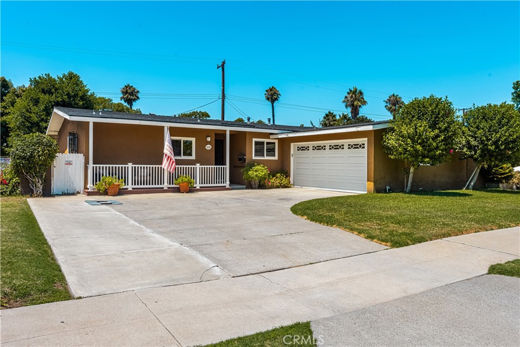 Welcome to this beautifully upgraded single-family home, perfectly situated in one of North Santa Ana’s most desirable neighborhoods. Tucked away on a quiet, single-loaded street with no neighbors across, this property enjoys serene views of a lush city-maintained park and greenbelt. Its location couldn’t be better—nestled in a “triangle” of three major freeways, providing unmatched convenience for commuters while maintaining a peaceful residential setting. The home boasts an expansive driveway with plenty of parking plus a spacious two-car garage that can easily fit oversized vehicles. Step inside to a semi-open floor plan that seamlessly connects the kitchen, dining, and living areas. The upgraded kitchen features granite countertops, modern cabinetry, a center island, and a cozy breakfast bar—flowing effortlessly into the adjacent dining room. The inviting living room offers soaring semi-vaulted ceilings, recessed lighting, and a statement fireplace, creating the perfect space to gather. With four generously sized bedrooms—including a primary suite with its own private bath—there’s room for everyone. One bedroom is currently set up as a home office, offering flexibility for today’s lifestyle needs. The backyard is equally impressive, with block wall fencing for privacy and a wide open grass area ideal for entertaining, play, or relaxation. This is a rare opportunity to own a home that combines thoughtful upgrades, modern living spaces, and a location that truly checks every box.