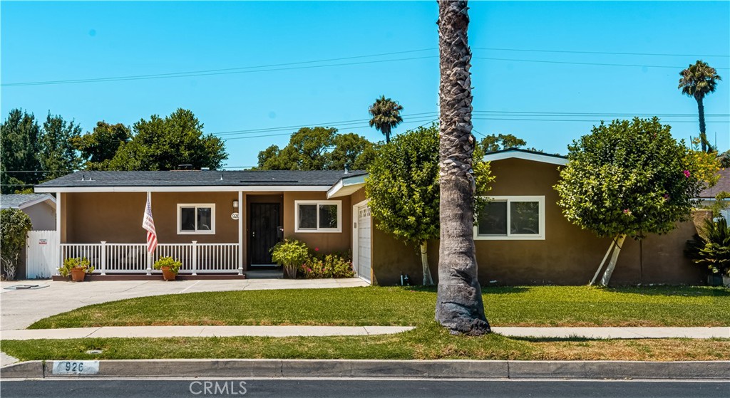 Welcome to this beautifully upgraded single-family home, perfectly situated in one of North Santa Ana’s most desirable neighborhoods. Tucked away on a quiet, single-loaded street with no neighbors across, this property enjoys serene views of a lush city-maintained park and greenbelt. Its location couldn’t be better—nestled in a “triangle” of three major freeways, providing unmatched convenience for commuters while maintaining a peaceful residential setting. The home boasts an expansive driveway with plenty of parking plus a spacious two-car garage that can easily fit oversized vehicles. Step inside to a semi-open floor plan that seamlessly connects the kitchen, dining, and living areas. The upgraded kitchen features granite countertops, modern cabinetry, a center island, and a cozy breakfast bar—flowing effortlessly into the adjacent dining room. The inviting living room offers soaring semi-vaulted ceilings, recessed lighting, and a statement fireplace, creating the perfect space to gather. With four generously sized bedrooms—including a primary suite with its own private bath—there’s room for everyone. One bedroom is currently set up as a home office, offering flexibility for today’s lifestyle needs. The backyard is equally impressive, with block wall fencing for privacy and a wide open grass area ideal for entertaining, play, or relaxation. This is a rare opportunity to own a home that combines thoughtful upgrades, modern living spaces, and a location that truly checks every box.