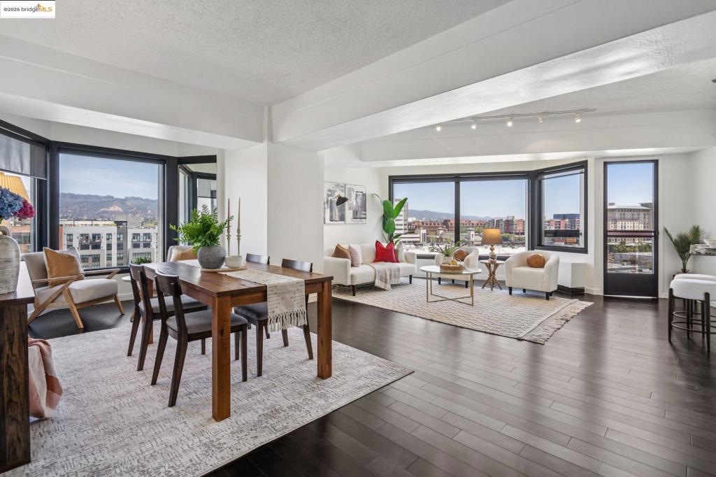Welcome to urban living at its finest in Unit 727, nestled within the sought-after Pacific Park Plaza at 6363 Christie Avenue in Emeryville. This modern, personable space offers 2 bedrooms and 1.5 bathrooms, perfect for a dynamic lifestyle. Step into a large open living room, dining room, and kitchen great room that invites entertaining and relaxation. There is a balcony off this living room area as well, The second bedroom doubles beautifully and is most useful as a home office or guest room, offering flexibility in design and function. Retreat to the expansive primary suite complete with a private balcony, where you can savor terrific urban views. Enjoy the luxury of one and a half baths, enhancing everyday convenience. Residents enjoy premium amenities, including a tennis court, pool, a gym, and meticulously maintained grounds. With designated guest and resident parking, plus the added reassurance of a doorman and 24/7 security, peace of mind is a given. This home serves as a gateway to a vibrant community, providing easy access to local dining, shopping, and public transportation. Your modern lifestyle awaits at Pacific Park Plaza.